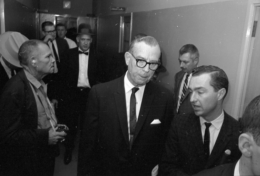 Dallas police station Jack Ruby shooting Lee Harvey Oswald; man in front  wearing glasses Justice of the Peace Pierce McBride; man next to wall is  Seth Kantor, reporter for Fort Worth Press