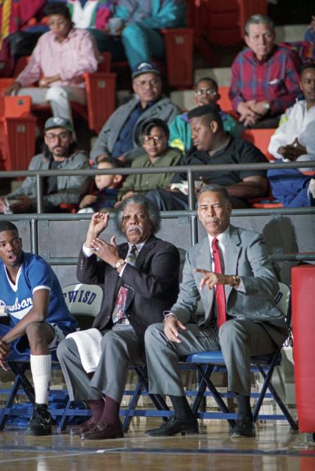 Dunbar High School basketball coaches Robert Hughes and Leondas Rambo during a game, Dunbar vs. O.D. Wyatt High School