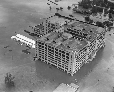Fort Worth flood of 1949 showing 7th Street under water. The large Montgomery Ward building received extensive damage