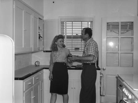 Vernon R. Childress and wife shown in house built with a G.I. loan
