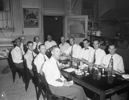 Group of men sitting at a dining table