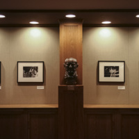 A bust of Sam Houston sits between exhibit photos