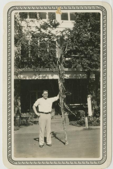 Frank Musick with sugar cane stalk at Rusk State Hospital