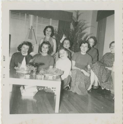 Shirley Sue Smith and a group of female friends posing in front of a Christmas tree