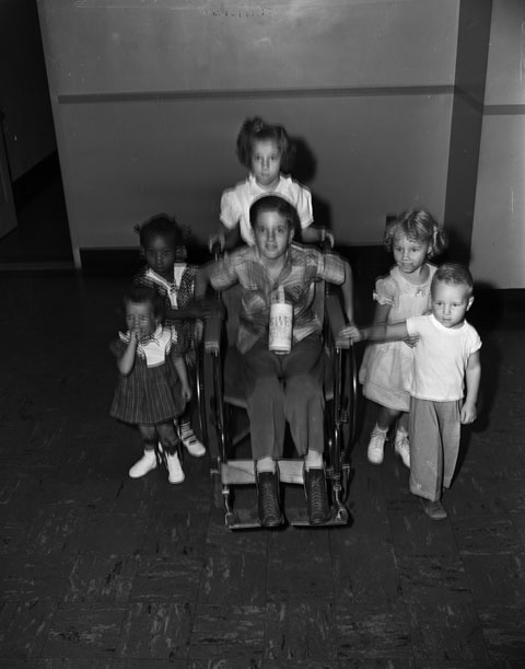 young polio patients, including one in a wheelchair, fundraising for a charitable organization