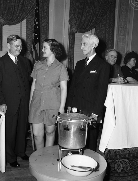 W.M. Massie and A.B. Vera congratulate Anne Lydick on recovery from polio