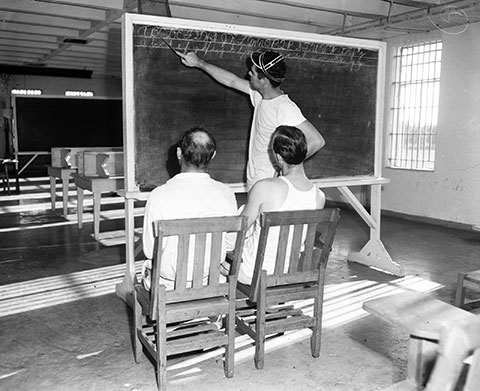 prisoner teaches two illiterate prisoners how to write