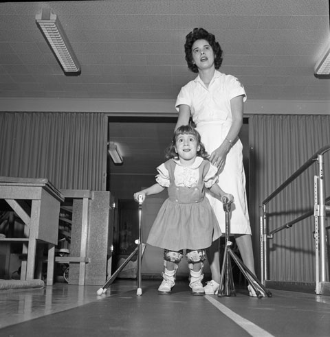 cerebral palsy patient assisted by a woman