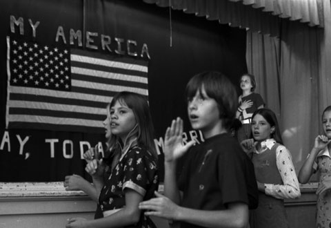 students use sign language for the Pledge of Allegiance to the flag