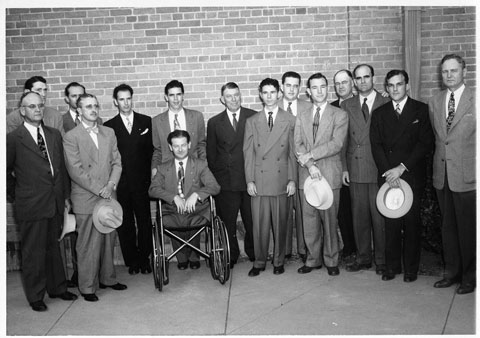 group of men with man in wheelchair