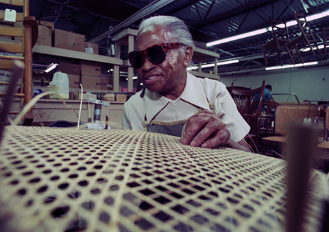 Katherine Brooks, age 74 and blind, has been caning chairs for 32 years