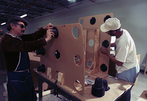 Johnny Leibas (left) and Larry McNeil work on a nine-cone pallet 