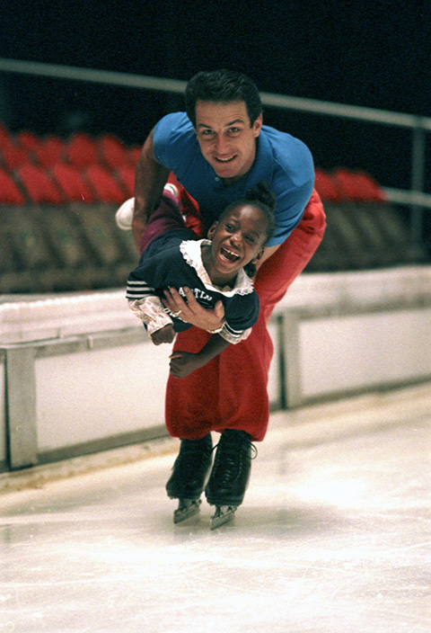 Tiffany Demus, a Special Olympics participant, enjoys ice skating with Nick Maricich