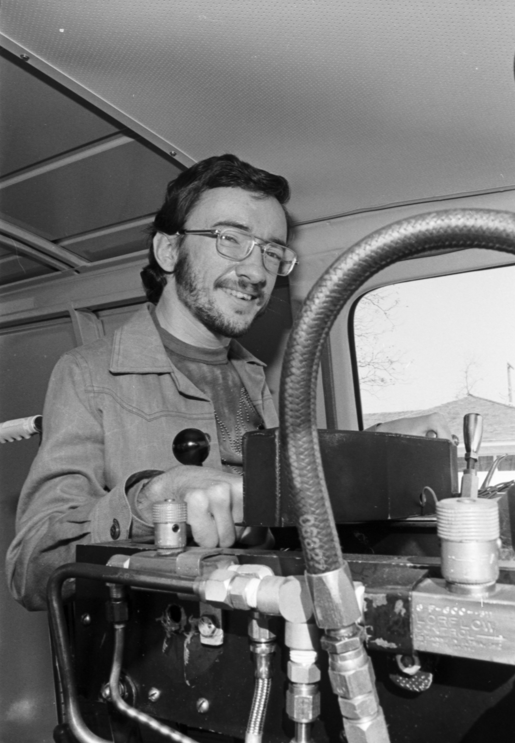 John Dycus driving a van that has been specially equipped for him