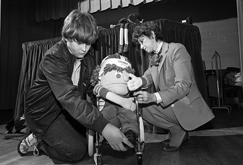 Michael Duncan (left) and teacher Marta White with wheelchair puppet
