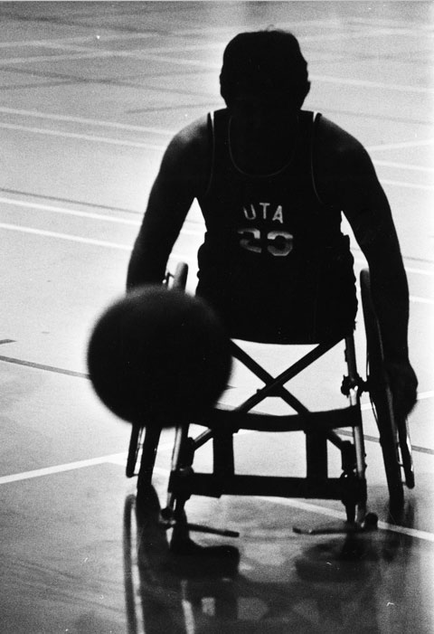 Ron LaBar in wheelchair dribbling basketball