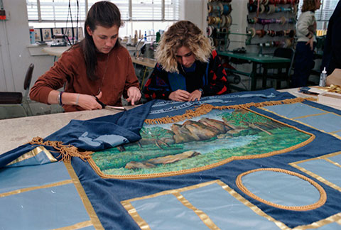 Students of costume and design department, Texas Christian University, work on quilt 