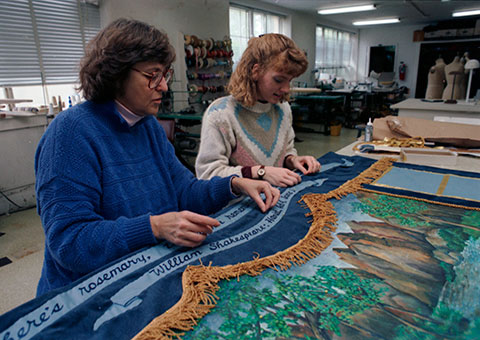 Lori Van Zandt (left) and Gretchen Pahan (right) work on quilt
