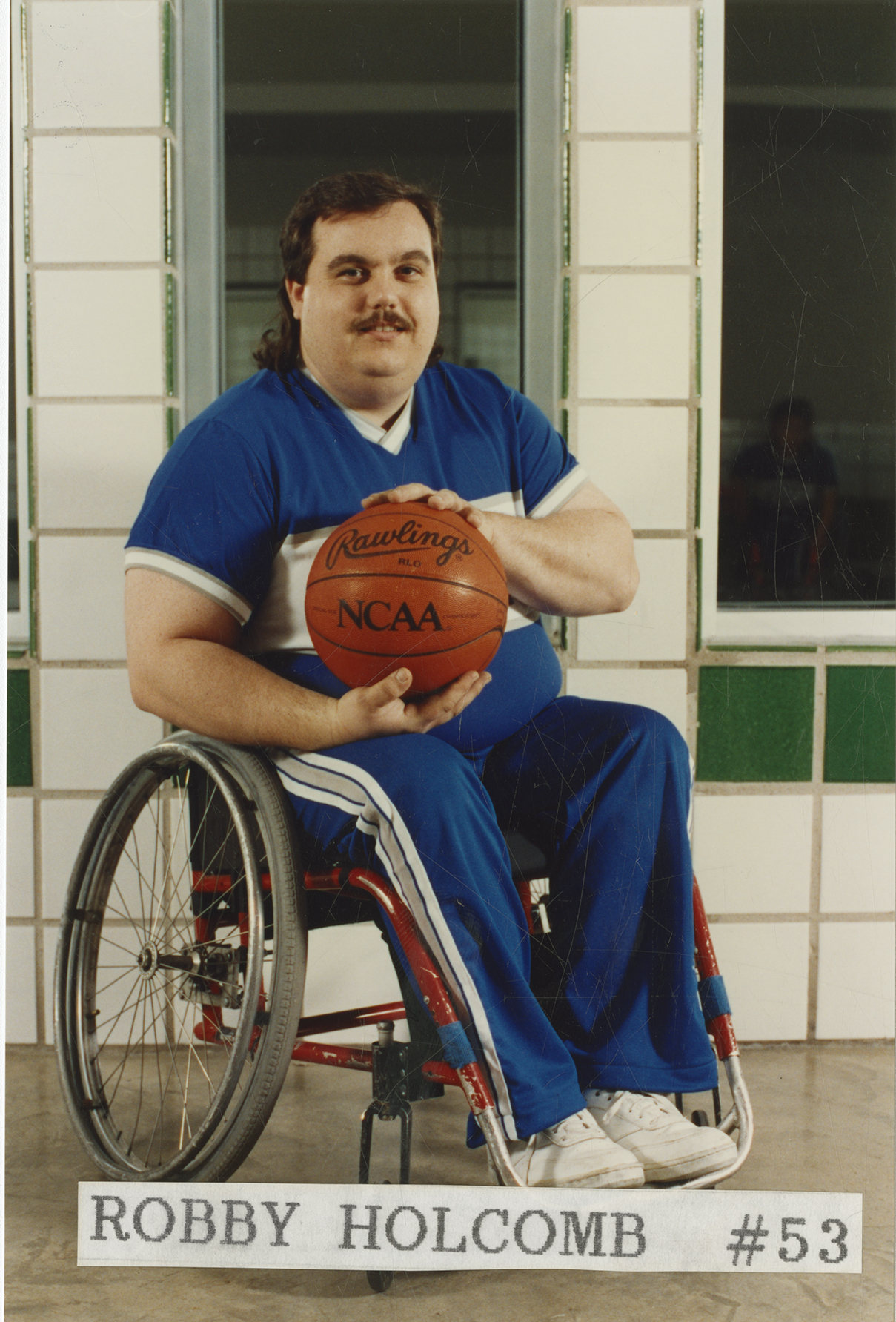 Color photograph of University of Texas at Arlington Movin' Mavs basketball player Robby Holcomb
