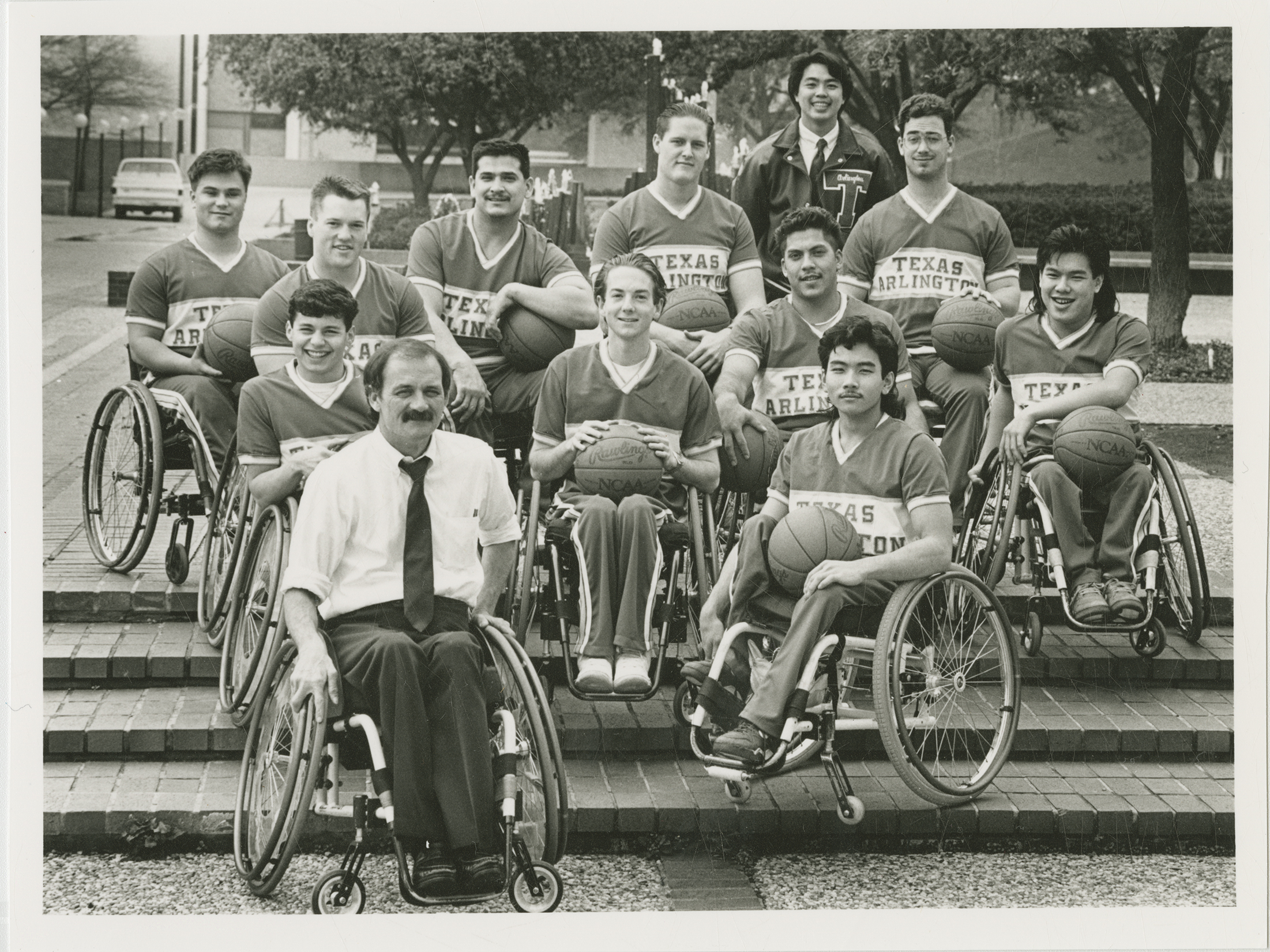 Members of the University of Texas at Arlington Movin' Mavs men's wheelchair basketball team pose for a team photograph