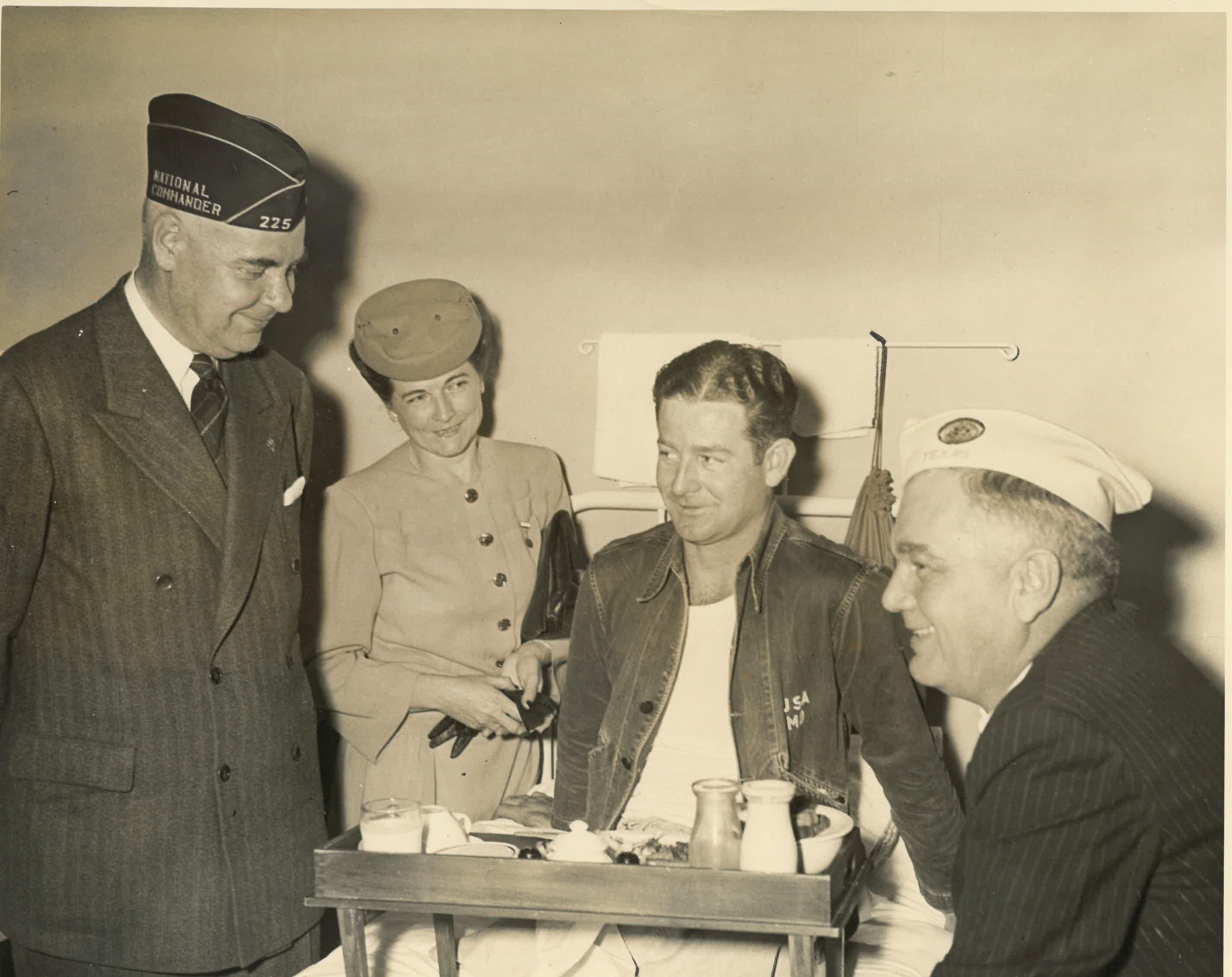 Photograph of American Legion officials and Mary Belle Cowen visiting Mr. Warren C. Cowen at the McCloskey General Hospital