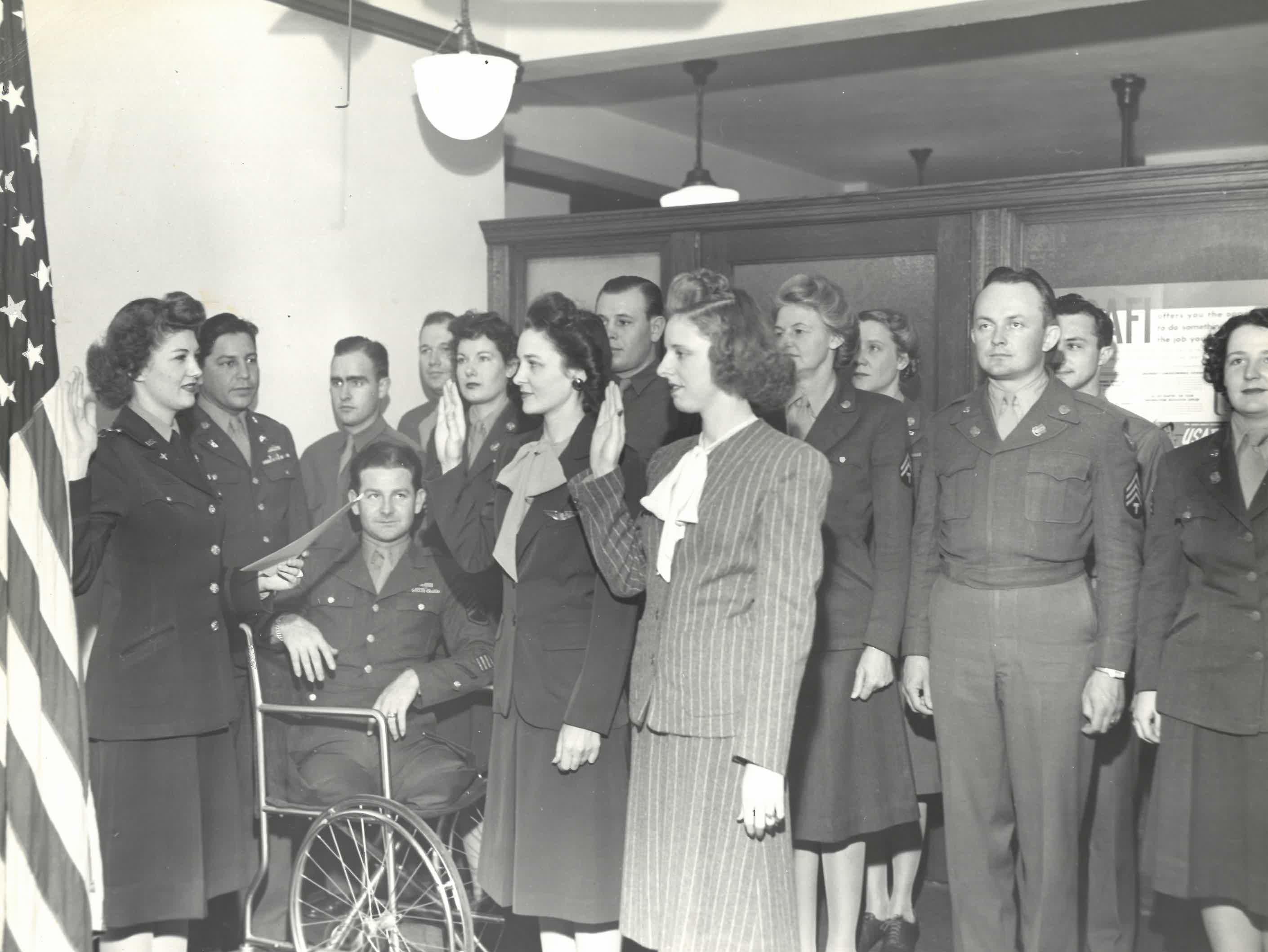 Photograph of Women's Army Corps soldiers being sworn-in at an induction ceremony