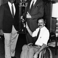 Photograph of Craig Williams, Dr. Wendell Nedderman and Jim Hayes holding a trophy