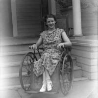 Polio patient Mary Elizabeth Runkles poses in her wheelchair during a Fort Worth visit from President Franklin D. Roosevelt
