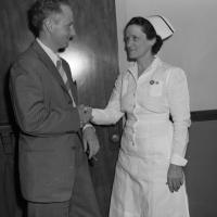 doctor and nurse standing and facing each other