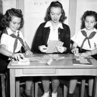 Camp Fire Girls prepare sheets of Christmas Seals