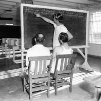 prisoner teaches two illiterate prisoners how to write