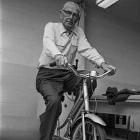 man uses bicycle exercise machine at rehabilitation center
