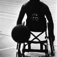 Ron LaBar in wheelchair dribbling basketball