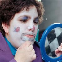 clown putting on makeup