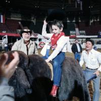 Rodeo for disabled children; Michael King rides make-believe bull