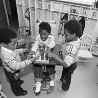 Handicapped Day Care Center, Byron and Brandon Graham play with Anthony Clemons