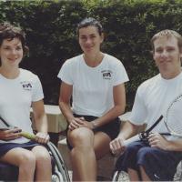 Members of the UTA women's and men's wheelchair tennis teams pose for a photograph