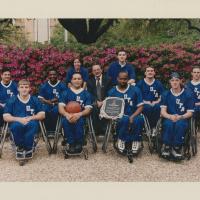 Members of the University of Texas at Arlington's Movin' Mavs men's wheelchair basketball team pose for a team photograph