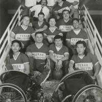 Members of the University of Texas at Arlington's Movin' Mavs men's wheelchair basketball team pose for a team photograph