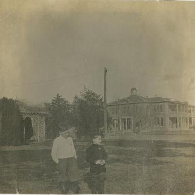 Two boys standing in front of North Texas Asylum