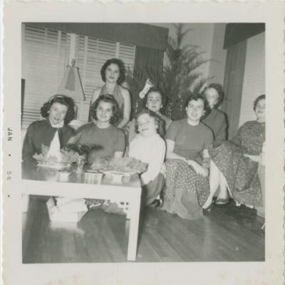 Shirley Sue Smith and a group of female friends posing in front of a Christmas tree