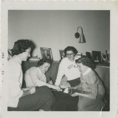Shirley Sue Smith and friends playing a board game.