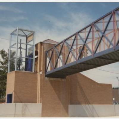 A color photograph of the completed Cooper Street pedestrian bridge on the University of Texas at Arlington campus