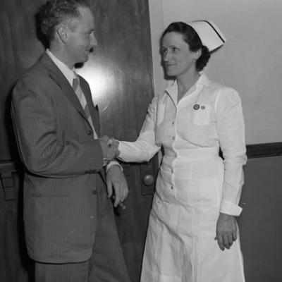 doctor and nurse standing and facing each other