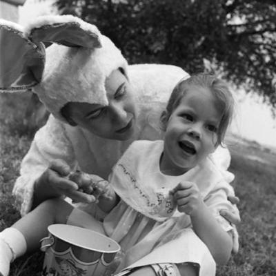 Child with cerebral palsy and an adult dressed in a bunny costume