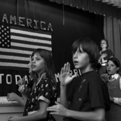 students use sign language for the Pledge of Allegiance to the flag