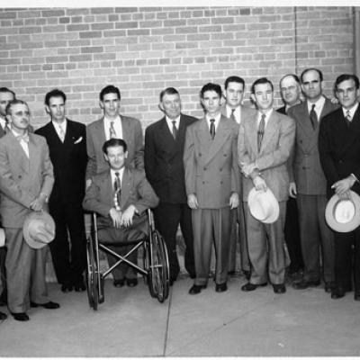 group of men with man in wheelchair