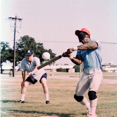 batter swings at a baseball fitted with a high-pitched beeper