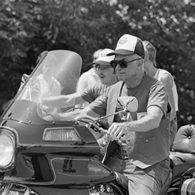 Malcolm Forbes, grand marshall for the "Texas Ride So Kids Can Walk" on motorcycle