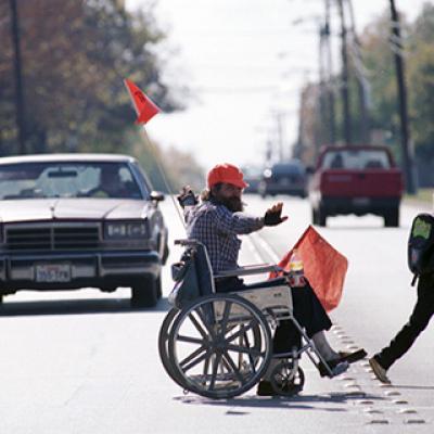 Handicapped Mike Middleton acts as lunchtime crossing guard 